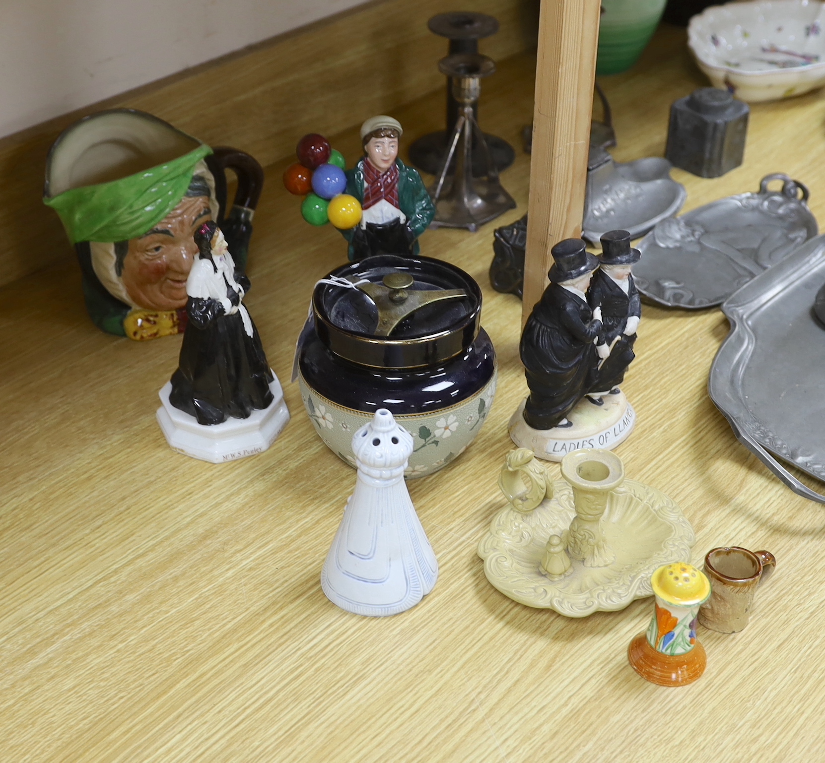 A Royal Doulton mug, two figures and a jar, a Clarice Cliff pepper and four other items (9), tallest Ballon Boy 20cm high